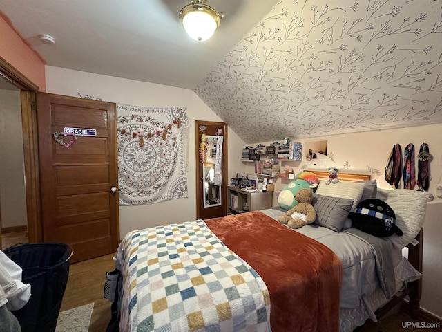 bedroom with lofted ceiling