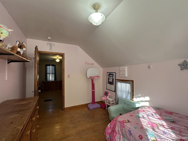 bedroom with hardwood / wood-style flooring and vaulted ceiling