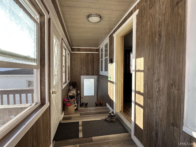 unfurnished sunroom featuring wood ceiling