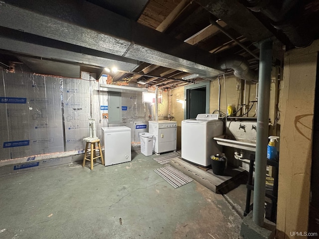 basement with fridge and washer and dryer