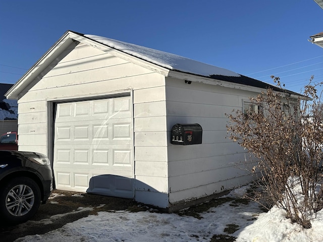 view of snow covered garage