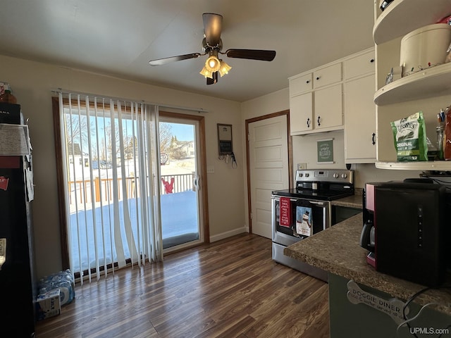 kitchen featuring ceiling fan, dark hardwood / wood-style flooring, stainless steel range with electric cooktop, and white cabinets