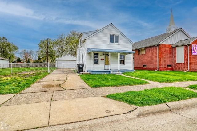 view of front of property featuring a garage, an outdoor structure, a porch, and a front yard