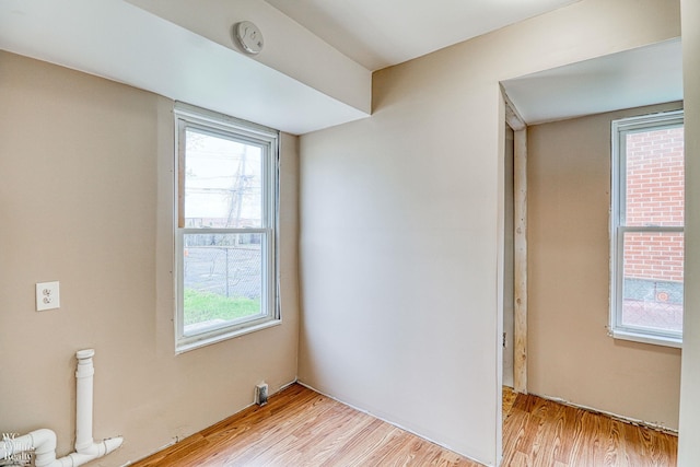 spare room featuring light wood-type flooring