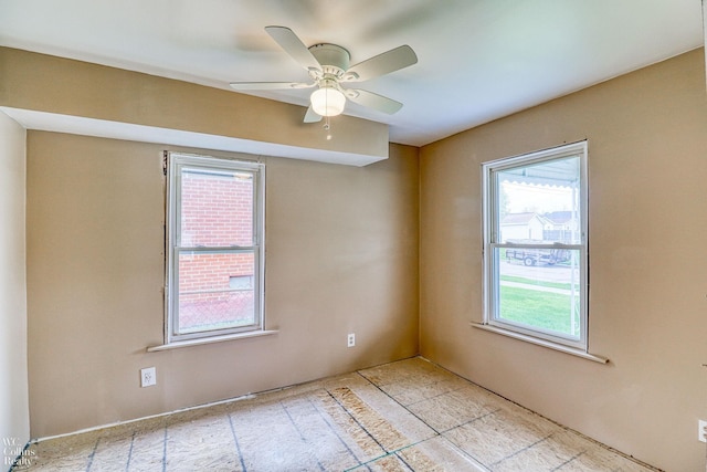 empty room featuring ceiling fan