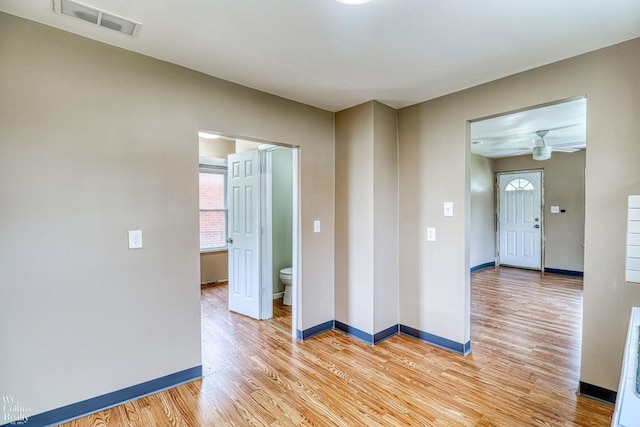 spare room with wood-type flooring and ceiling fan