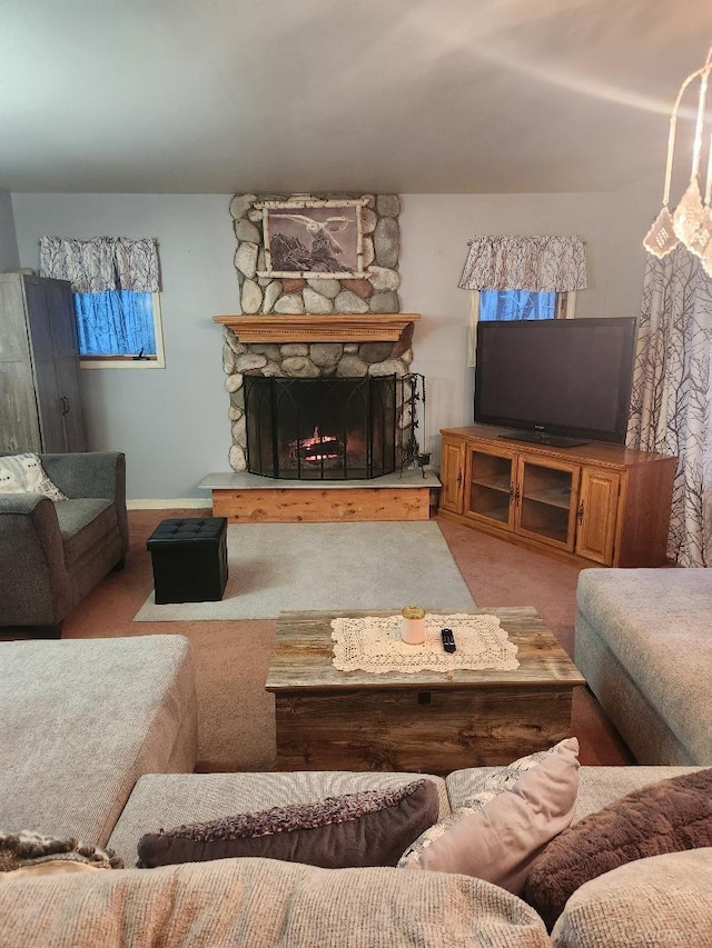 carpeted living room featuring a fireplace