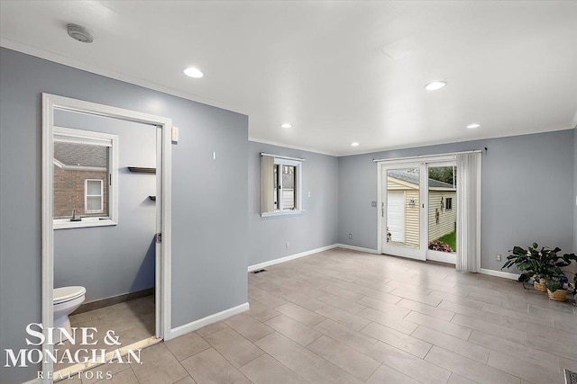 empty room featuring ornamental molding