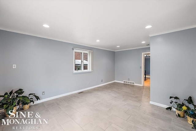 empty room featuring ornamental molding