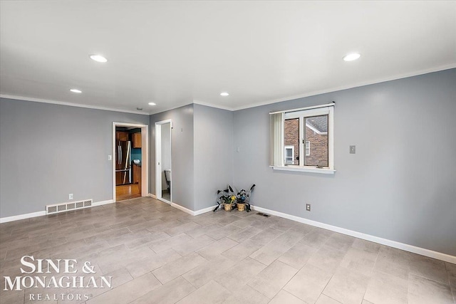 spare room featuring ornamental molding