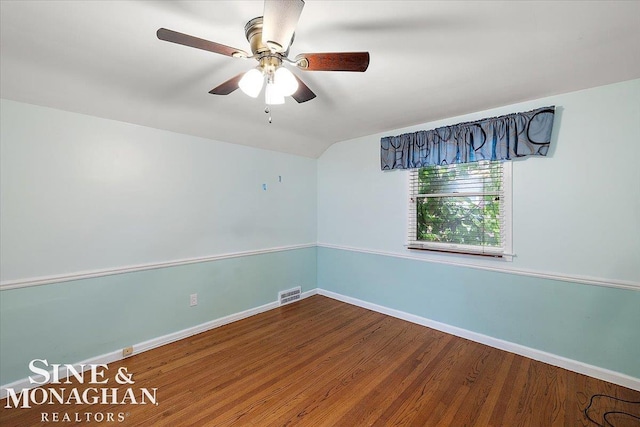 unfurnished room featuring wood-type flooring, lofted ceiling, and ceiling fan