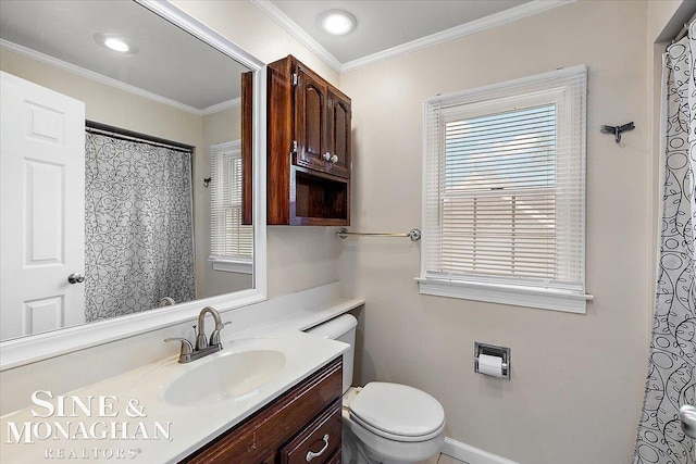 bathroom featuring vanity, crown molding, and toilet