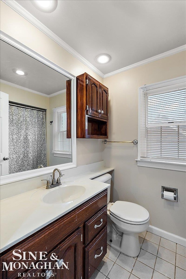 bathroom with ornamental molding, toilet, tile patterned flooring, and vanity