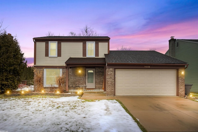 front of property with a garage