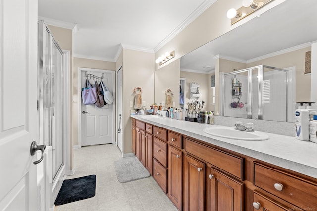 bathroom featuring vanity, an enclosed shower, and crown molding