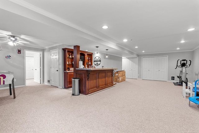 bar featuring crown molding, ceiling fan, decorative light fixtures, and light carpet