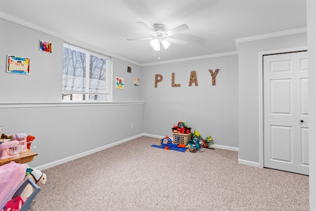 game room featuring ornamental molding, carpet, and ceiling fan