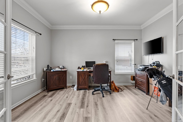 home office with ornamental molding and light hardwood / wood-style floors