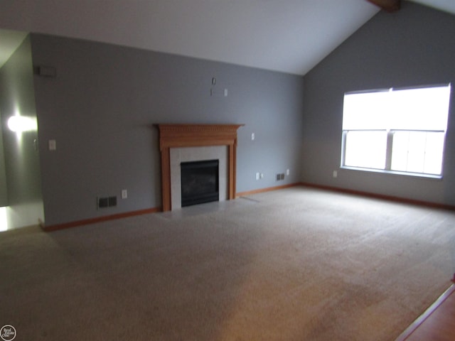 unfurnished living room featuring carpet floors, vaulted ceiling with beams, and a fireplace