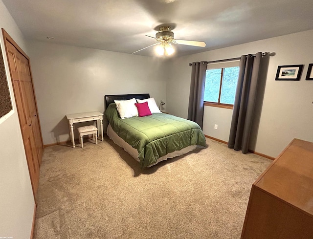 bedroom with ceiling fan and carpet