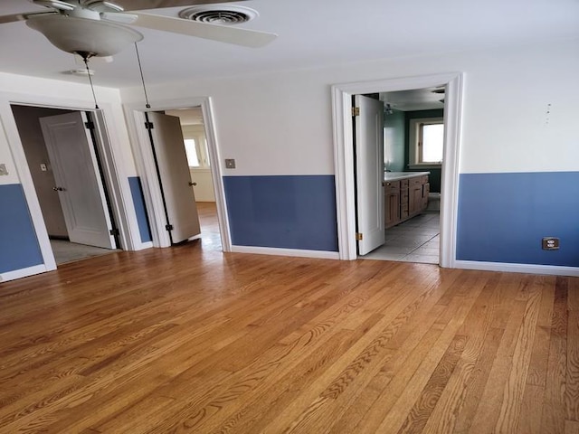 spare room featuring light wood-type flooring