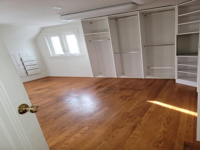 unfurnished bedroom with hardwood / wood-style floors