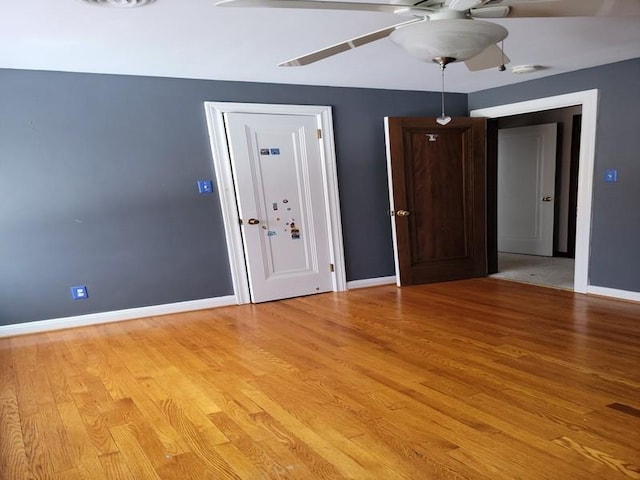 unfurnished room featuring ceiling fan and light hardwood / wood-style floors