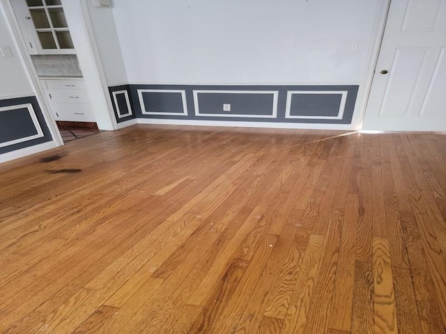 unfurnished living room featuring light hardwood / wood-style floors