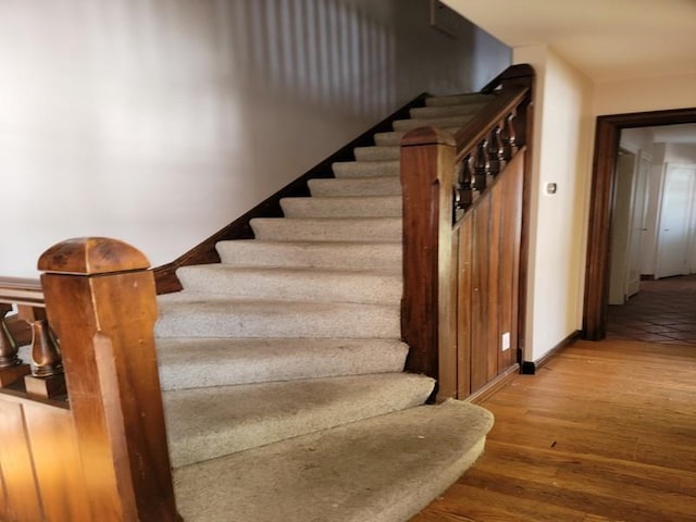 stairway with wood-type flooring