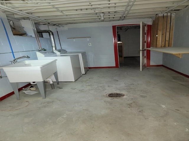 basement with sink and independent washer and dryer