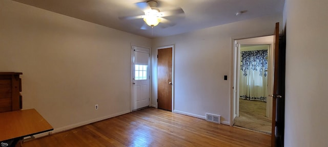 unfurnished bedroom featuring light hardwood / wood-style floors and ceiling fan