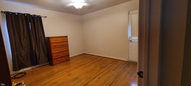 unfurnished bedroom with light wood-type flooring