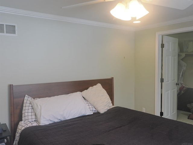 bedroom with visible vents and ornamental molding