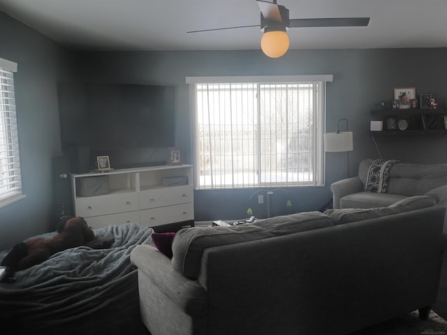 living room featuring a ceiling fan