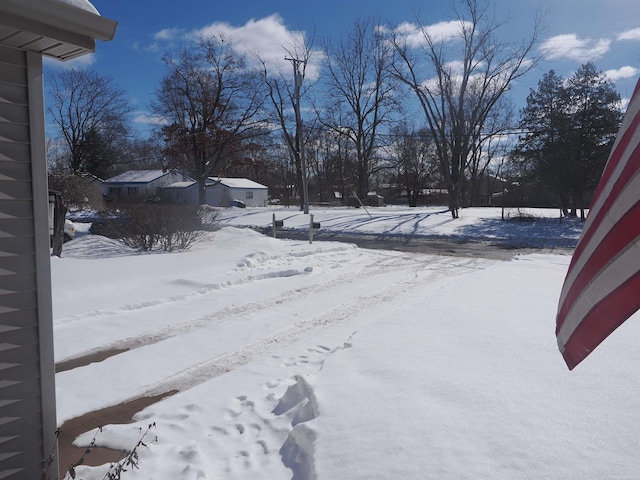 view of yard layered in snow