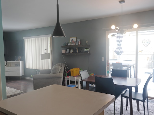 dining room featuring an inviting chandelier and wood finished floors