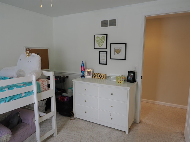 bedroom with light colored carpet and visible vents