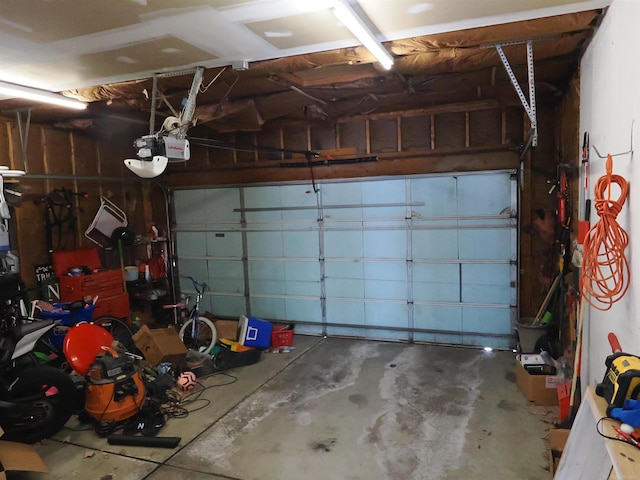 garage featuring a garage door opener