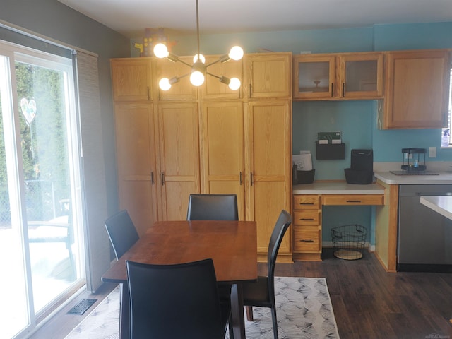 dining area with a notable chandelier, visible vents, and wood finished floors