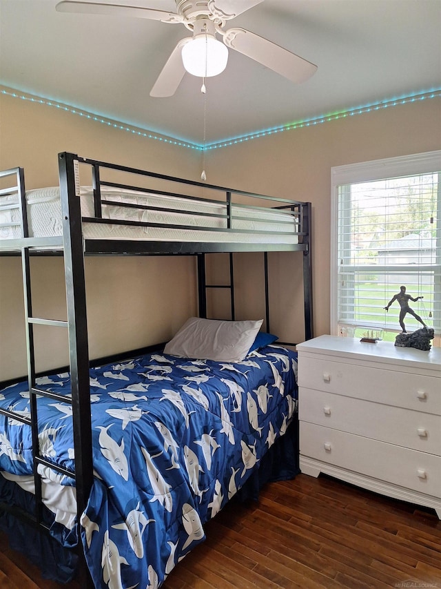 bedroom featuring dark wood-type flooring and ceiling fan