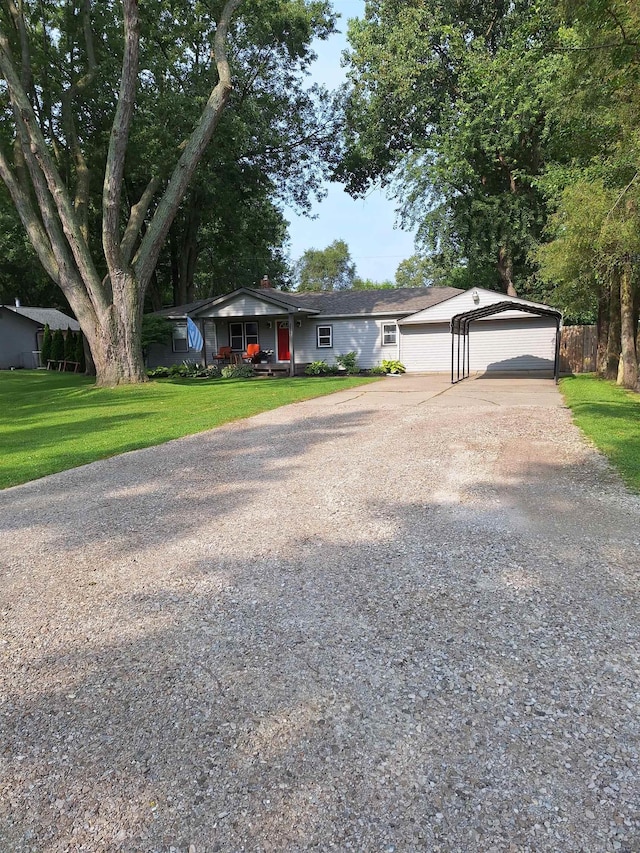 ranch-style house featuring a garage and a front yard