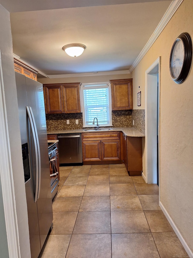 kitchen featuring crown molding, stainless steel appliances, sink, and decorative backsplash