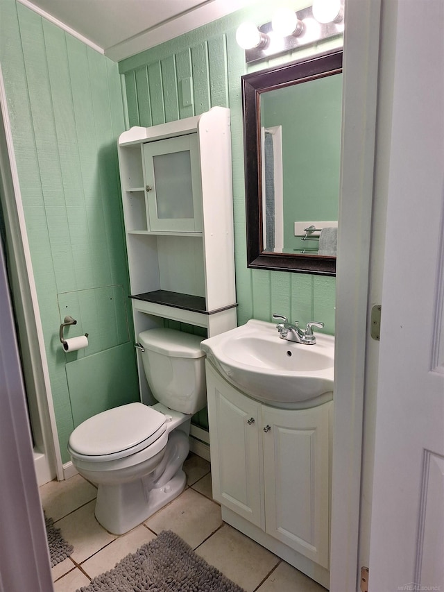 bathroom with tile patterned floors, toilet, and vanity