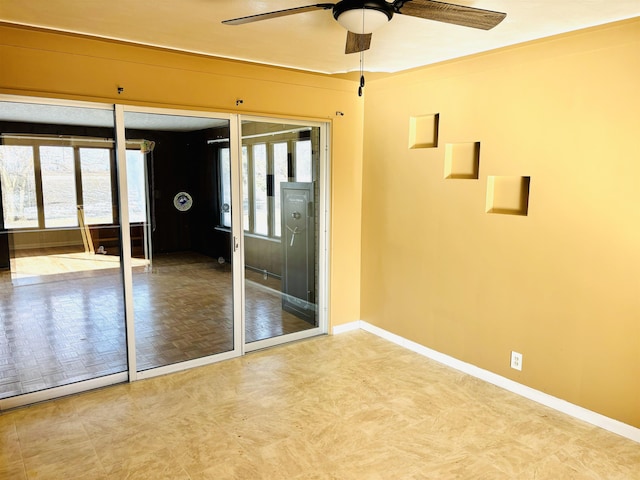 empty room featuring ceiling fan