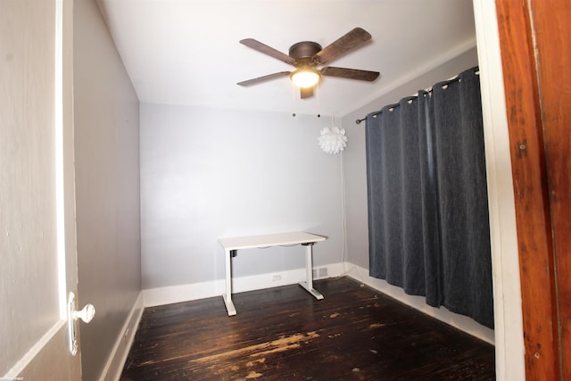 interior space featuring ceiling fan and dark hardwood / wood-style flooring