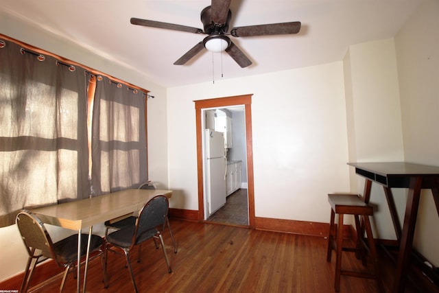 dining space featuring dark hardwood / wood-style floors and ceiling fan