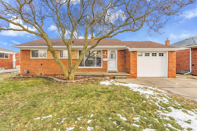 single story home with a garage and a front lawn