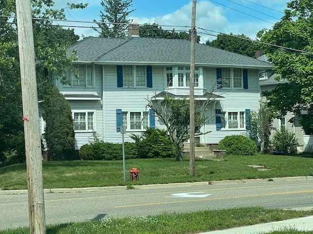 view of front of home with a front yard