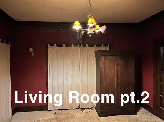 unfurnished bedroom featuring a notable chandelier