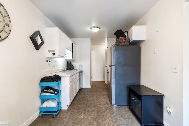 kitchen with stainless steel appliances and white cabinets